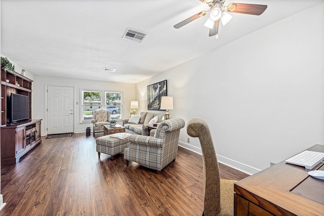 2510 Cypress Dr, Galveston, TX 77551 - living room with dark wood-style floors, baseboards, and a ceiling fan