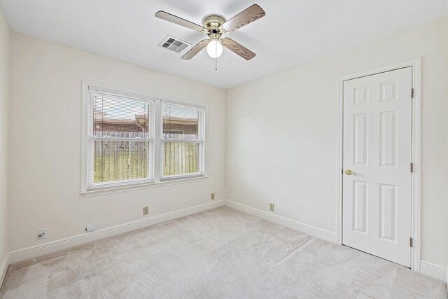 2510 Cypress Dr, Galveston, TX 77551 - unfurnished room featuring light colored carpet, baseboards, and a ceiling fan