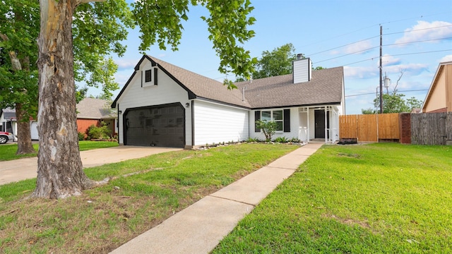 24006 Scrivener Ln, Katy, TX 77493 - view of front of house with a chimney, roof with shingles, and driveway