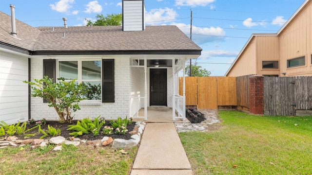 24006 Scrivener Ln, Katy, TX 77493 - view of front facade featuring brick siding, a shingled roof, and a chimney