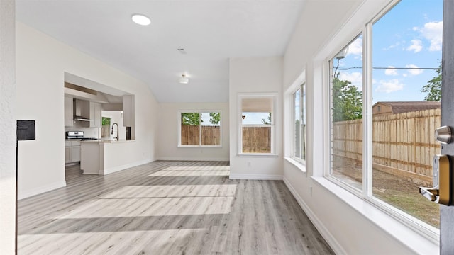 24006 Scrivener Ln, Katy, TX 77493 - unfurnished sunroom with a sink, wood finished floors, and baseboards