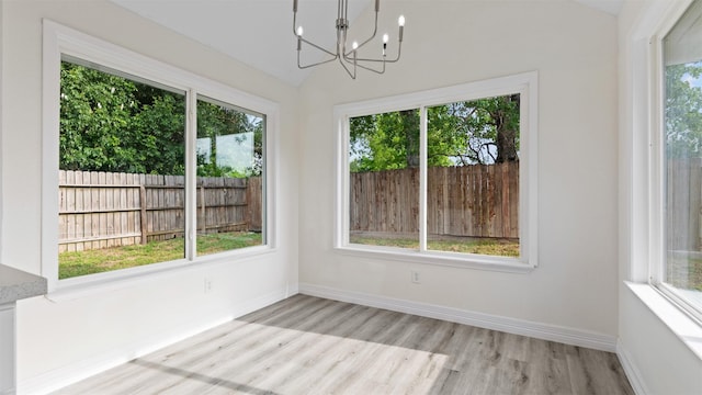 24006 Scrivener Ln, Katy, TX 77493 - unfurnished sunroom with a chandelier and lofted ceiling