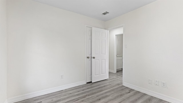 24006 Scrivener Ln, Katy, TX 77493 - empty room with baseboards and light wood-style floors
