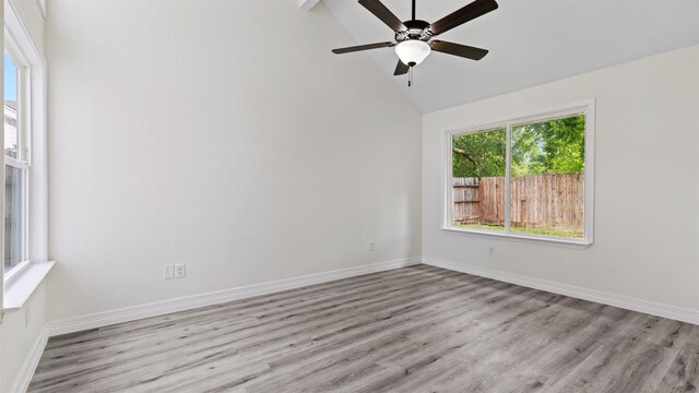24006 Scrivener Ln, Katy, TX 77493 - spare room featuring wood finished floors, baseboards, a ceiling fan, and high vaulted ceiling