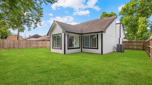 24006 Scrivener Ln, Katy, TX 77493 - rear view of house with roof with shingles and central air condition unit
