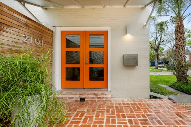 2101 Banks St, Houston, TX 77098 - doorway to property featuring french doors and brick siding