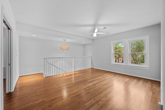 2101 Banks St, Houston, TX 77098 - unfurnished room featuring ceiling fan, wood finished floors, and baseboards