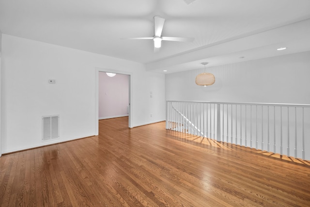 2101 Banks St, Houston, TX 77098 - empty room featuring a ceiling fan, wood finished floors, and baseboards