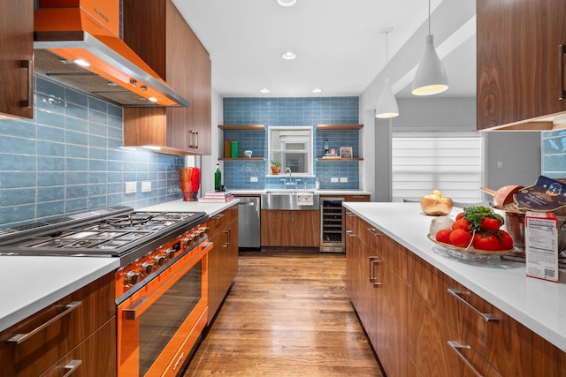 2101 Banks St, Houston, TX 77098 - kitchen with stainless steel appliances, custom range hood, wine cooler, light wood-style floors, and modern cabinets