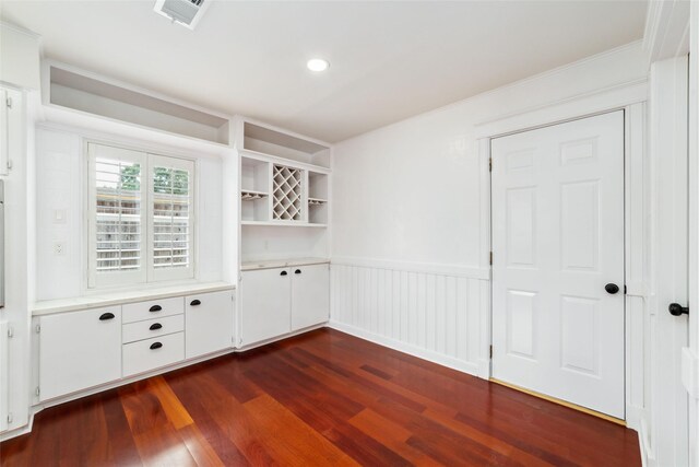 9643 Meadowcroft Dr, Houston, TX 77063 - interior space featuring dark wood-type flooring, wainscoting, and crown molding