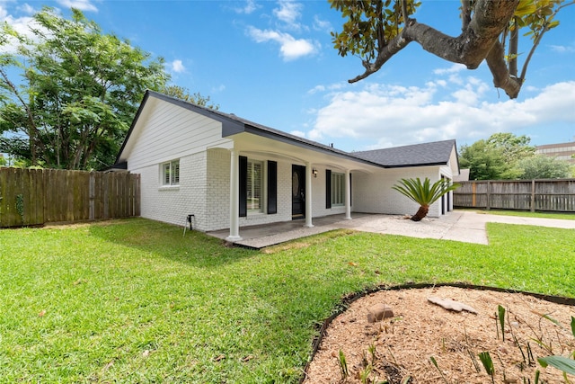 9643 Meadowcroft Dr, Houston, TX 77063 - back of property with brick siding and a patio area