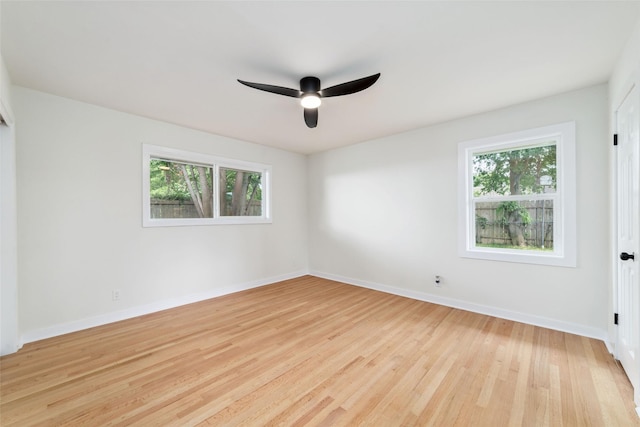 9643 Meadowcroft Dr, Houston, TX 77063 - empty room with a ceiling fan, light wood-type flooring, and baseboards