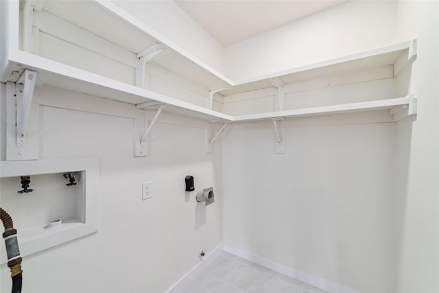 9643 Meadowcroft Dr, Houston, TX 77063 - laundry area with hookup for a washing machine, baseboards, and electric dryer hookup