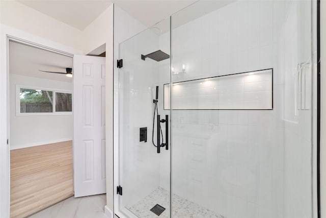 9643 Meadowcroft Dr, Houston, TX 77063 - bathroom with tiled shower, ceiling fan, and baseboards