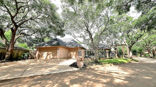 19823 Sunbridge Ln, Houston, TX 77094 - view of front of house with a garage, driveway, and brick siding