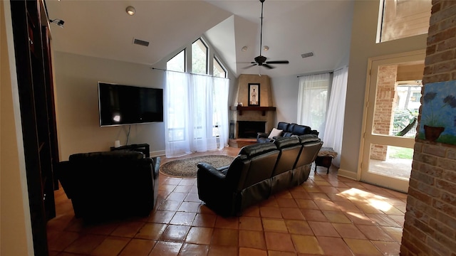 19823 Sunbridge Ln, Houston, TX 77094 - living room with a fireplace with raised hearth, healthy amount of natural light, light tile patterned flooring, and high vaulted ceiling