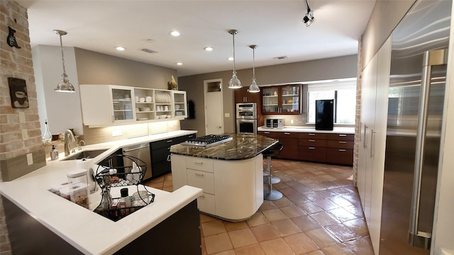 19823 Sunbridge Ln, Houston, TX 77094 - kitchen with a sink, stainless steel appliances, open shelves, decorative backsplash, and glass insert cabinets