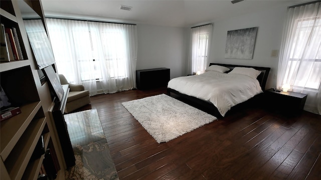 19823 Sunbridge Ln, Houston, TX 77094 - bedroom featuring multiple windows and dark wood finished floors