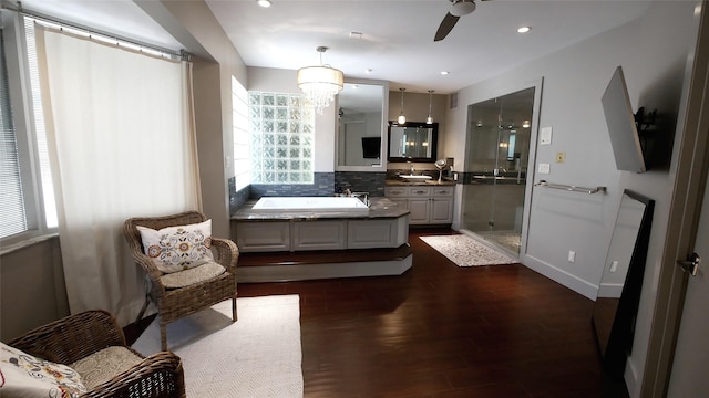 19823 Sunbridge Ln, Houston, TX 77094 - full bathroom with a stall shower, vanity, wood finished floors, a ceiling fan, and a bath