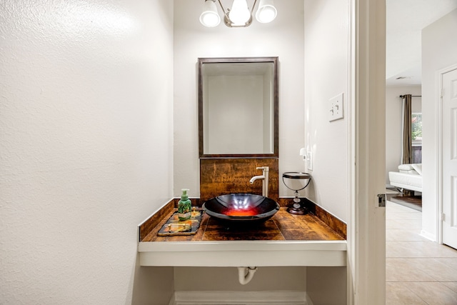 17823 Scenic Oaks Dr, Richmond, TX 77407 - bathroom featuring a sink and tile patterned flooring