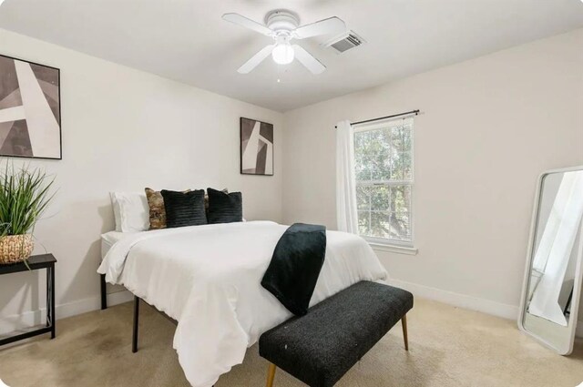 1609 Palcio Real Dr, Houston, TX 77047 - bedroom featuring light carpet, baseboards, and ceiling fan