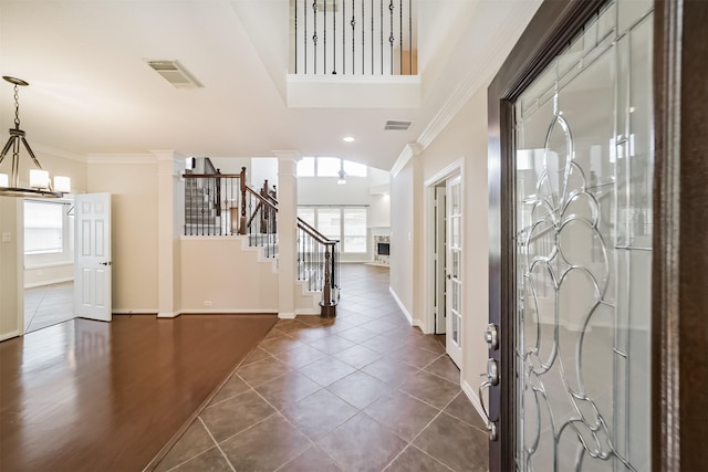 7319 Fair Meadow Ln, Katy, TX 77494 - entrance foyer with plenty of natural light, decorative columns, crown molding, baseboards, and stairway