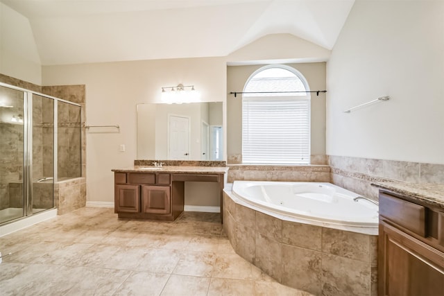 7319 Fair Meadow Ln, Katy, TX 77494 - bathroom featuring lofted ceiling, vanity, a jetted tub, a shower stall, and tile patterned flooring