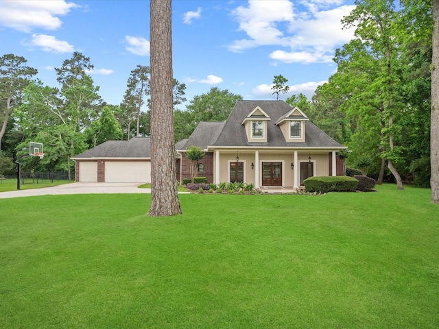 9810 Clubhouse Cir, Magnolia, TX 77354 - cape cod house with a front lawn, driveway, roof with shingles, a porch, and a detached garage