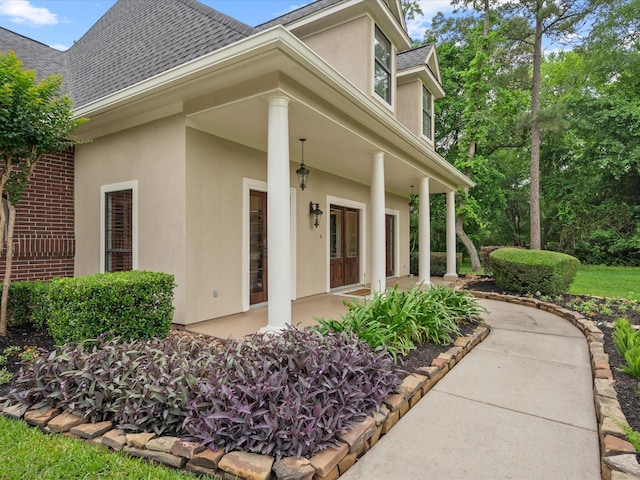 9810 Clubhouse Cir, Magnolia, TX 77354 - view of side of property featuring stucco siding and a shingled roof