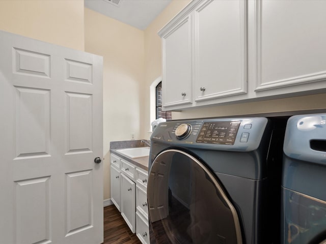 9810 Clubhouse Cir, Magnolia, TX 77354 - laundry area with washer / clothes dryer, cabinet space, and dark wood-style floors