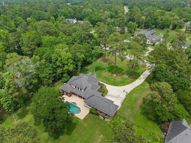 9810 Clubhouse Cir, Magnolia, TX 77354 - aerial view of a pool area and a heavily wooded area