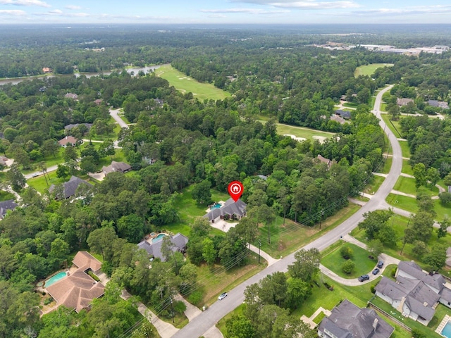 9810 Clubhouse Cir, Magnolia, TX 77354 - aerial overview of property's location with a heavily wooded area and nearby suburban area