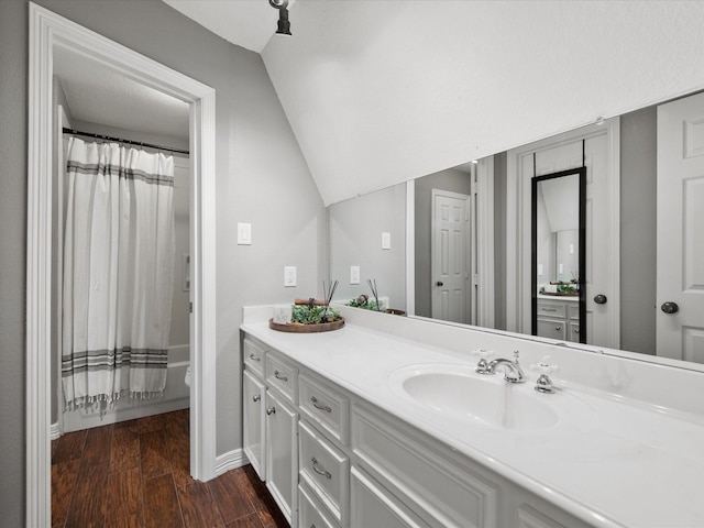 9810 Clubhouse Cir, Magnolia, TX 77354 - full bathroom with vanity, wood finished floors, toilet, curtained shower, and lofted ceiling