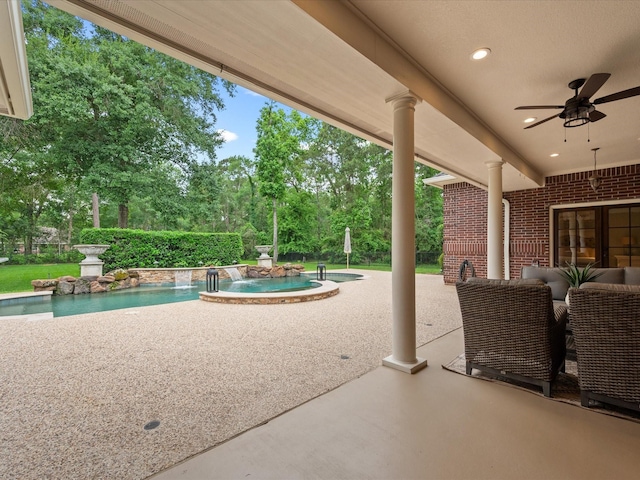 9810 Clubhouse Cir, Magnolia, TX 77354 - view of patio / terrace featuring a pool with connected hot tub, a ceiling fan, and view of wooded area