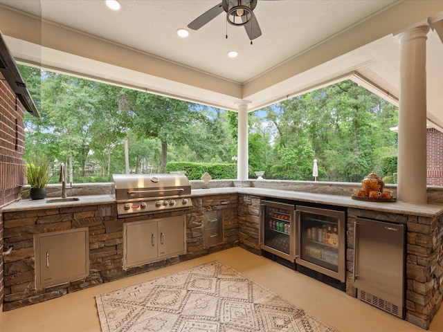9810 Clubhouse Cir, Magnolia, TX 77354 - view of patio / terrace featuring a sink, beverage cooler, view of scattered trees, and a ceiling fan
