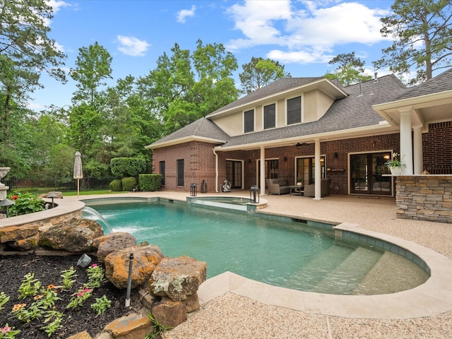 9810 Clubhouse Cir, Magnolia, TX 77354 - view of pool featuring a patio area, a pool with connected hot tub, and an outdoor hangout area