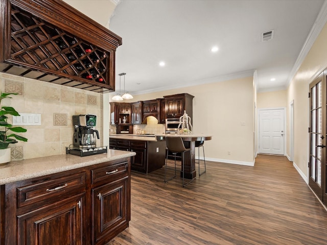 9810 Clubhouse Cir, Magnolia, TX 77354 - kitchen with backsplash, crown molding, dark brown cabinetry, dark wood-style floors, and a kitchen island