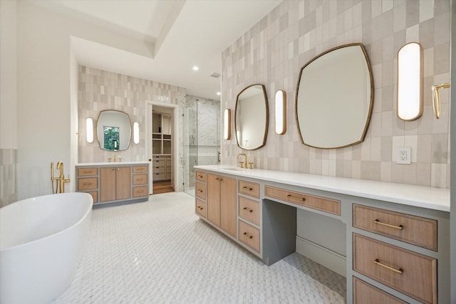 3755 Rice Blvd, Houston, TX 77005 - full bathroom with vanity, a freestanding bath, tile walls, tasteful backsplash, and a shower