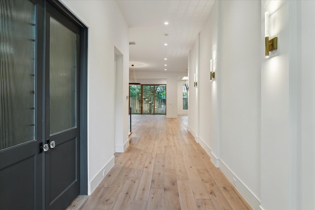 3755 Rice Blvd, Houston, TX 77005 - hall with light wood-type flooring, recessed lighting, and baseboards