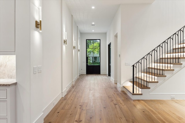 3755 Rice Blvd, Houston, TX 77005 - entrance foyer with light wood-style floors, recessed lighting, stairs, and baseboards