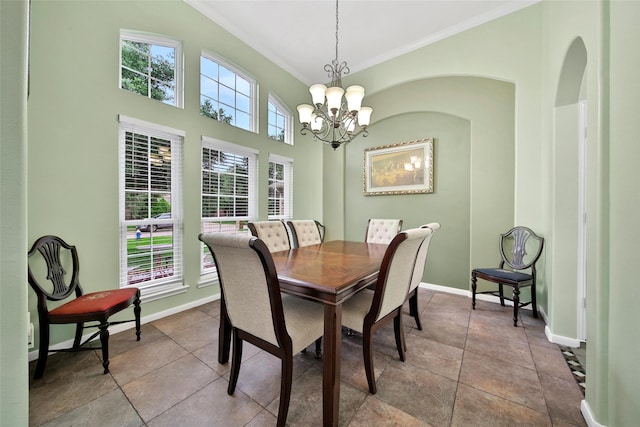 12010 Piney Bend Dr, Tomball, TX 77375 - dining space featuring crown molding, baseboards, and a chandelier