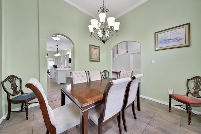 12010 Piney Bend Dr, Tomball, TX 77375 - dining room featuring arched walkways, a chandelier, crown molding, baseboards, and light tile patterned flooring
