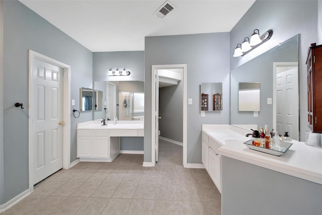 12010 Piney Bend Dr, Tomball, TX 77375 - bathroom featuring two vanities, tile patterned flooring, baseboards, and toilet