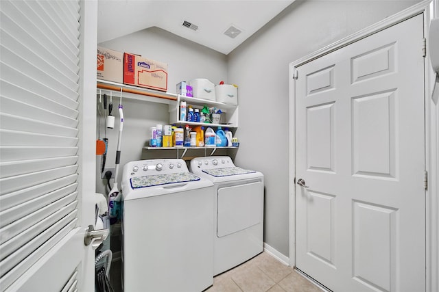 12010 Piney Bend Dr, Tomball, TX 77375 - laundry room featuring independent washer and dryer and light tile patterned flooring