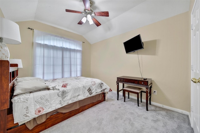 12010 Piney Bend Dr, Tomball, TX 77375 - carpeted bedroom with vaulted ceiling, baseboards, and ceiling fan