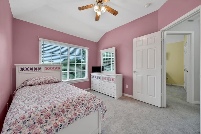 12010 Piney Bend Dr, Tomball, TX 77375 - bedroom with light colored carpet, vaulted ceiling, baseboards, and ceiling fan