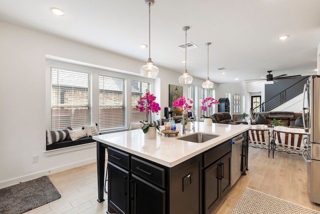 221 Sky Top Dr, Montgomery, TX 77316 - kitchen with a sink, healthy amount of natural light, light wood-style flooring, light countertops, and recessed lighting