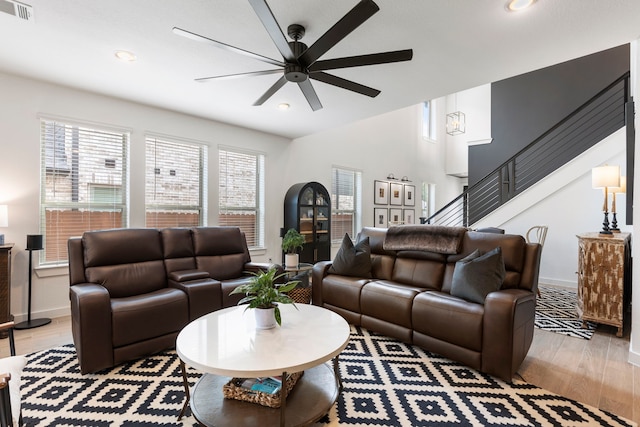 221 Sky Top Dr, Montgomery, TX 77316 - living area featuring a ceiling fan, light wood finished floors, stairway, baseboards, and recessed lighting