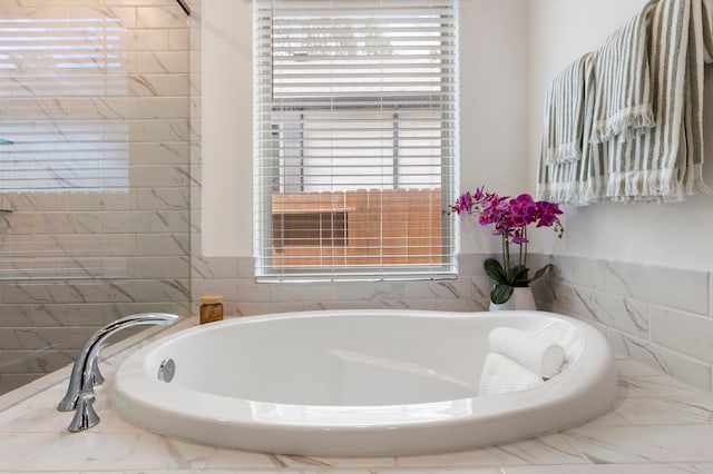 221 Sky Top Dr, Montgomery, TX 77316 - full bathroom featuring a garden tub and marble finish floors