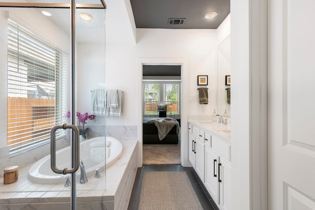 221 Sky Top Dr, Montgomery, TX 77316 - ensuite bathroom featuring vanity, a bath, and recessed lighting